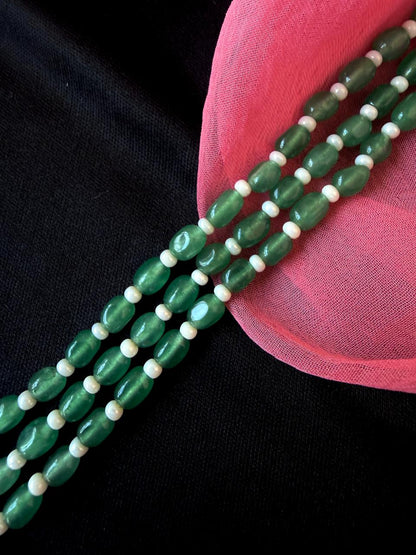Green and white beaded necklace