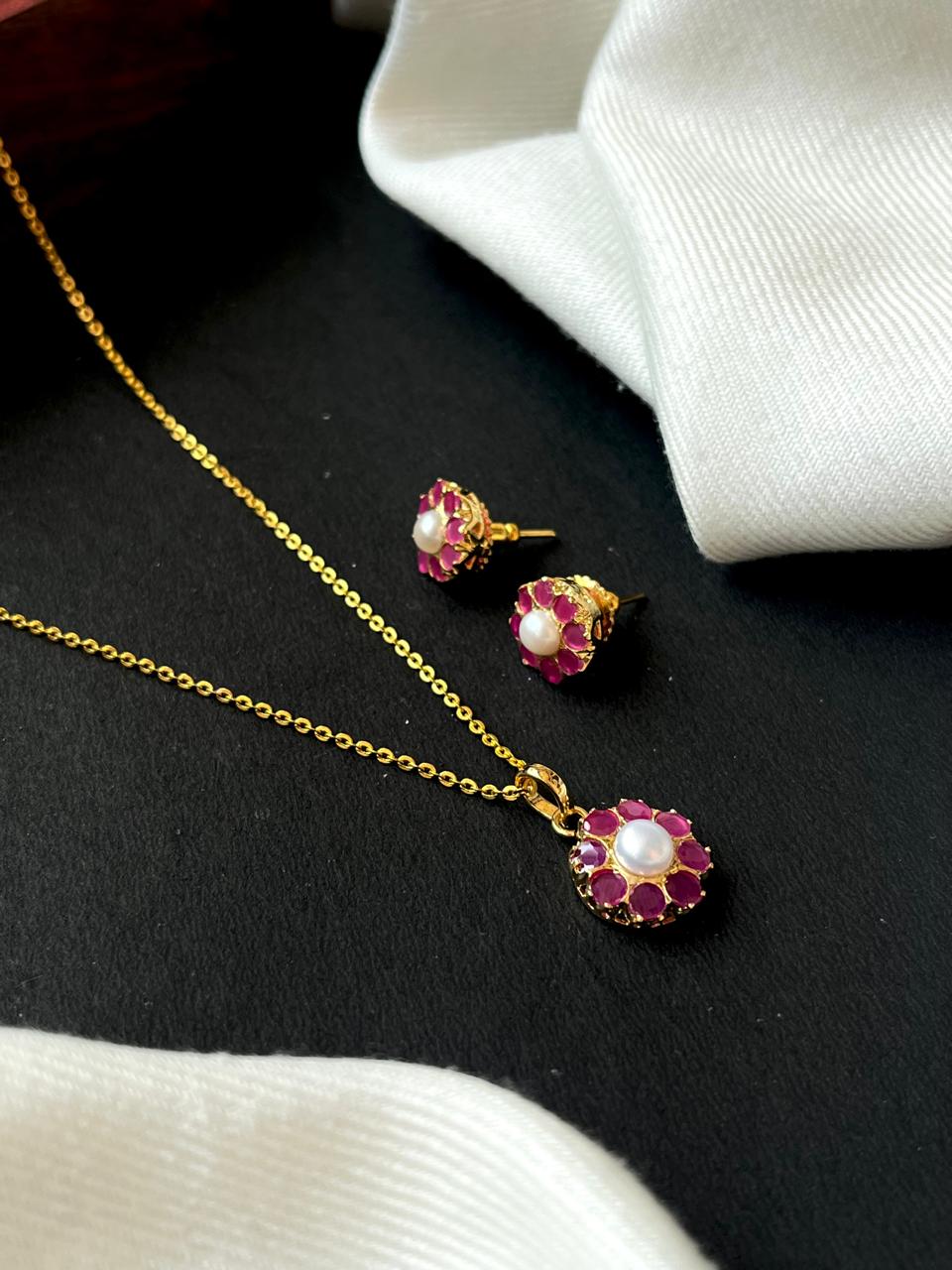 Gold necklace with red and pearl pendant 